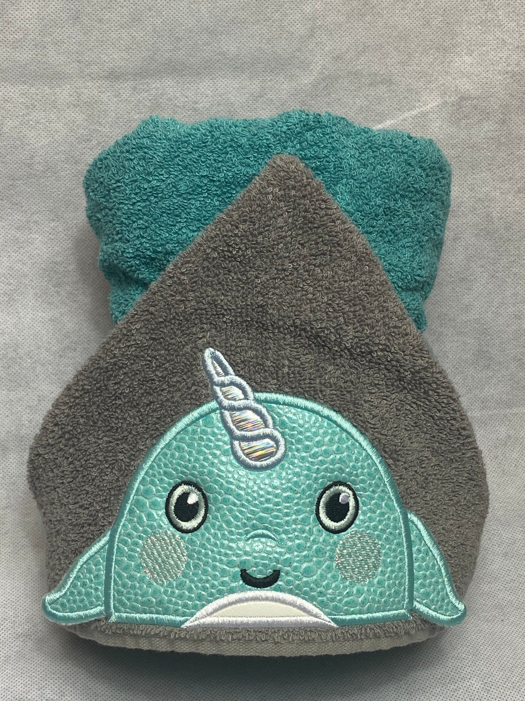 Narwhal character hooded towel