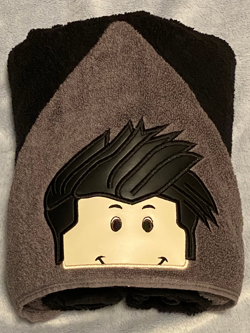 Boy character hooded towel